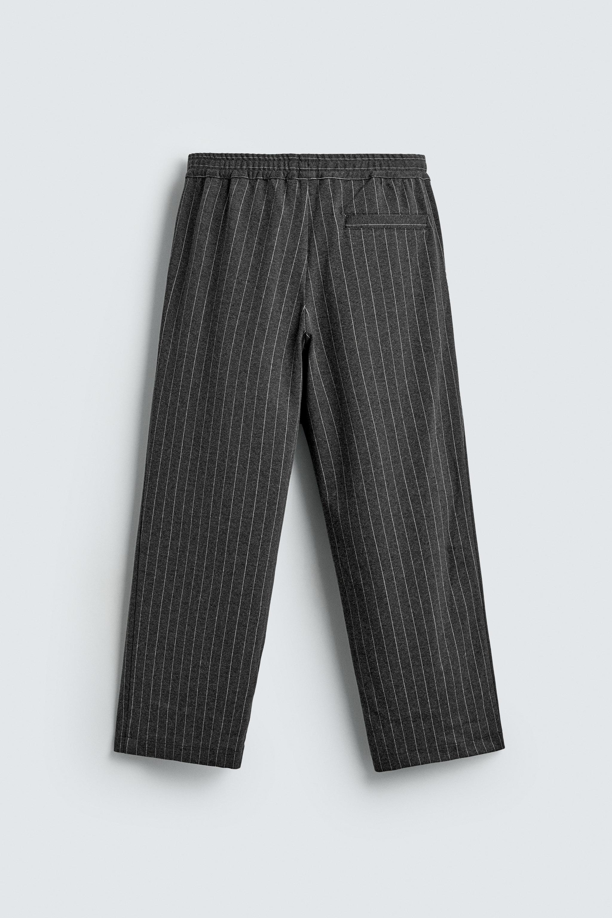 PANTALON À RAYURES TENNIS ET PLIS